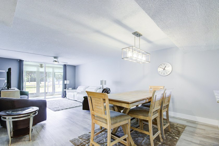 YOU WILL WANT THIS 1ST FLOOR... END UNIT ...WITH IMPACT GLASS - photo 6