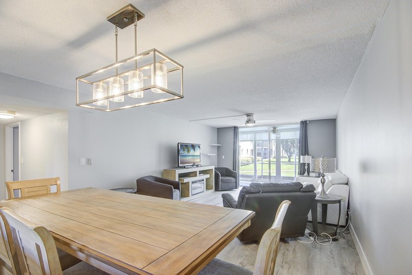 YOU WILL WANT THIS 1ST FLOOR... END UNIT ...WITH IMPACT GLASS - photo 7
