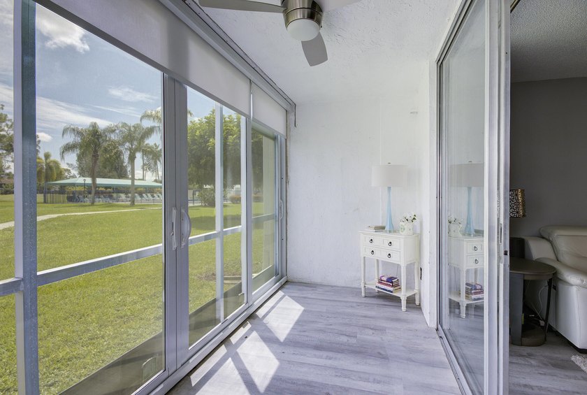 YOU WILL WANT THIS 1ST FLOOR... END UNIT ...WITH IMPACT GLASS - photo 10