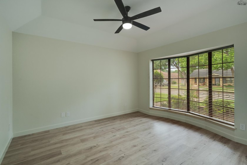 Tucked on a corner lot in Midwestern Park, this 4-bed, 3-bath - photo 24