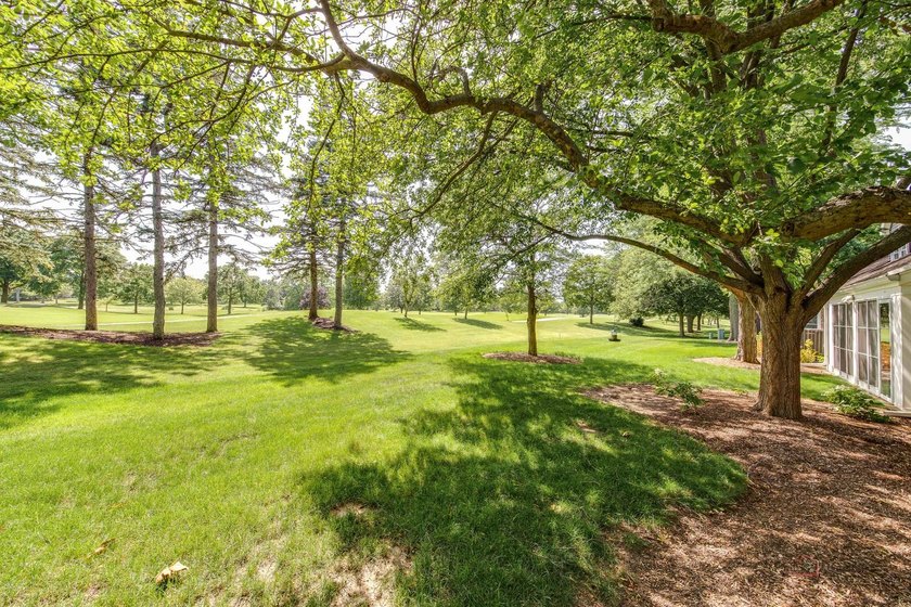 Welcome to this stunning golf course property offering an open - photo 25