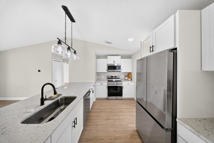 Welcome home to this beautifully updated modern residence where - photo 15