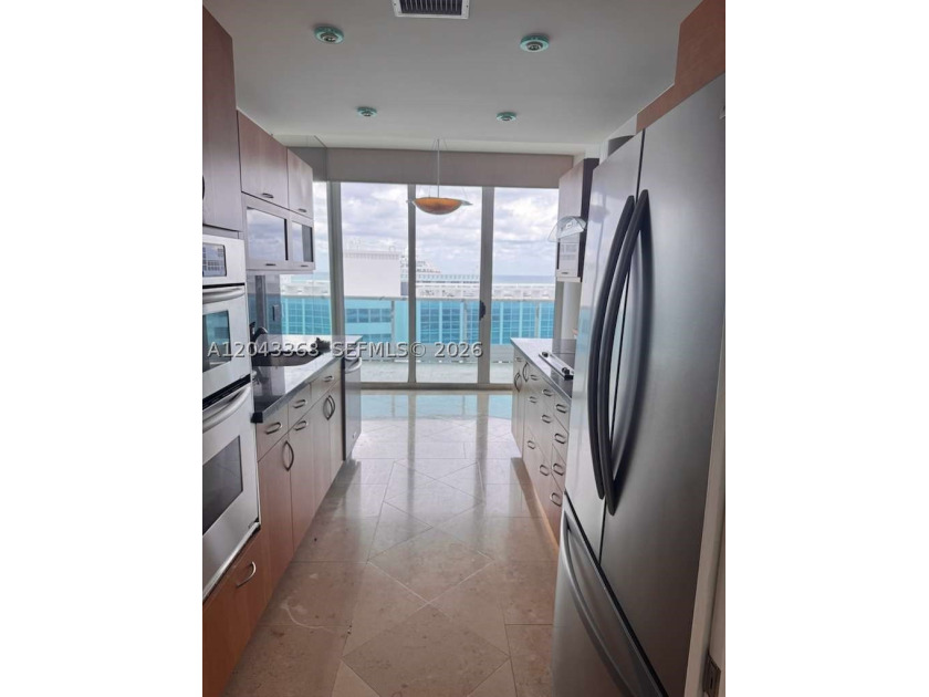 Beach's most sought-after boutique oceanfront buildings! In the - photo 6