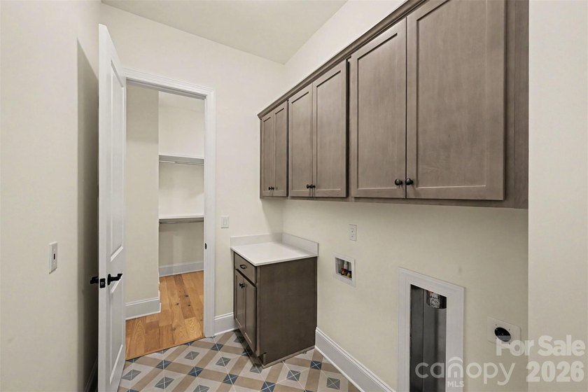 Move-in ready new construction in the gated lakefront community - photo 31