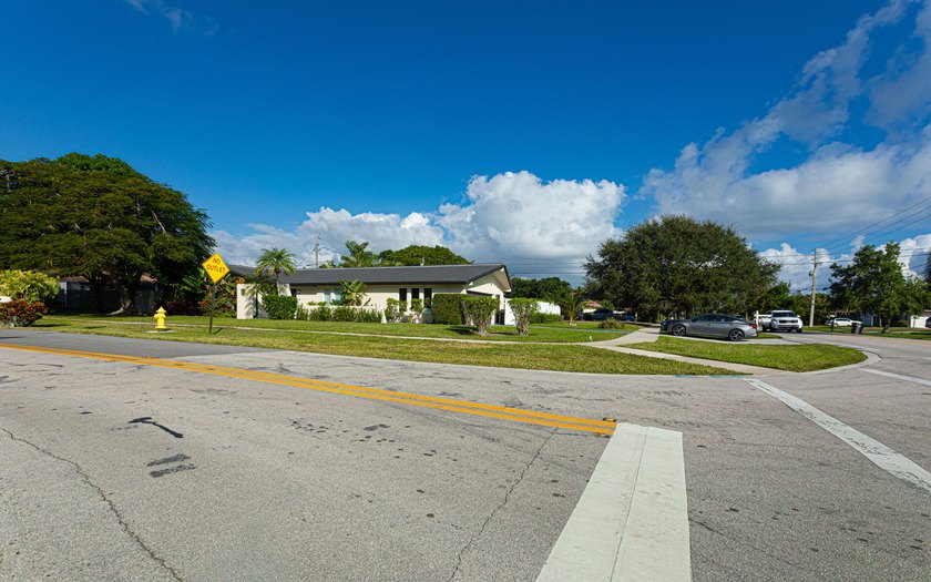 Tucked away on an oversized corner lot in the sought-after - photo 5