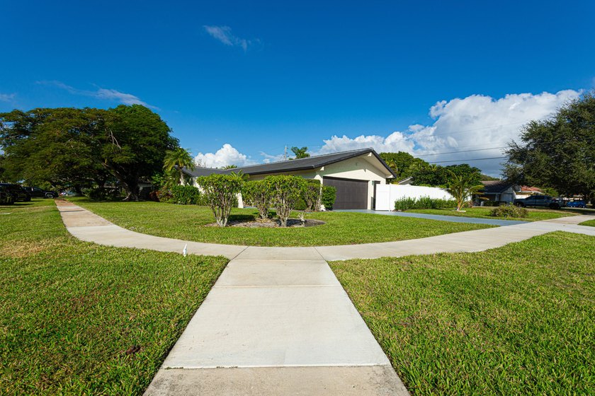 Tucked away on an oversized corner lot in the sought-after - photo 6