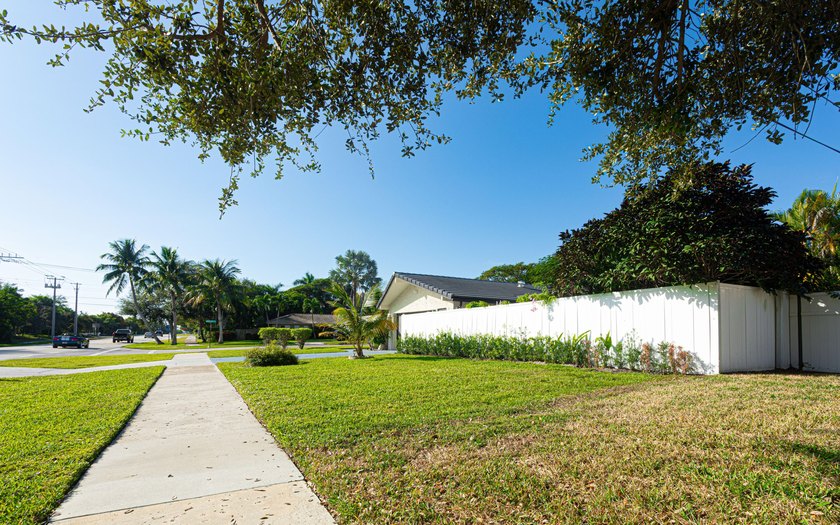 Tucked away on an oversized corner lot in the sought-after - photo 7