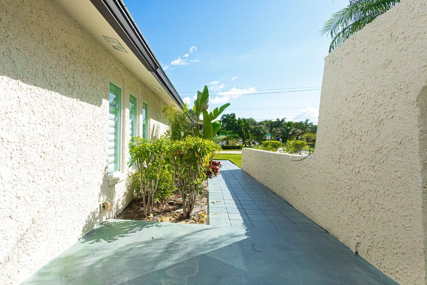 Tucked away on an oversized corner lot in the sought-after - photo 8