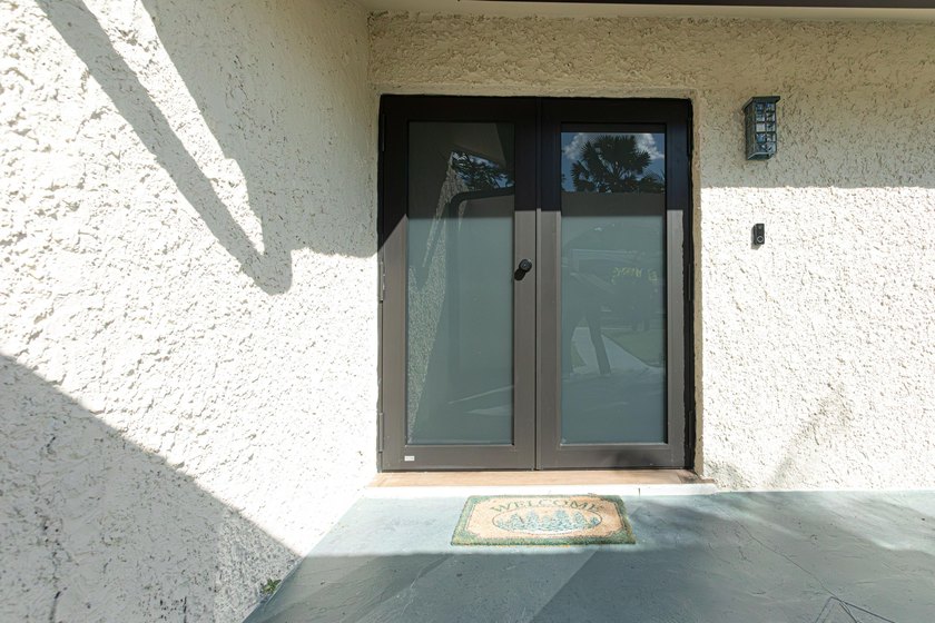 Tucked away on an oversized corner lot in the sought-after - photo 9