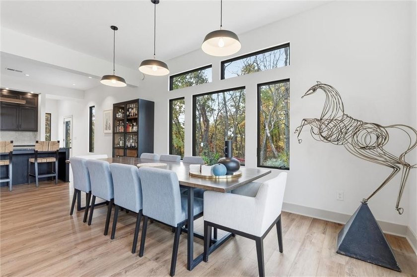 Welcome to a modern masterpiece set on 30-acres that captures - photo 16