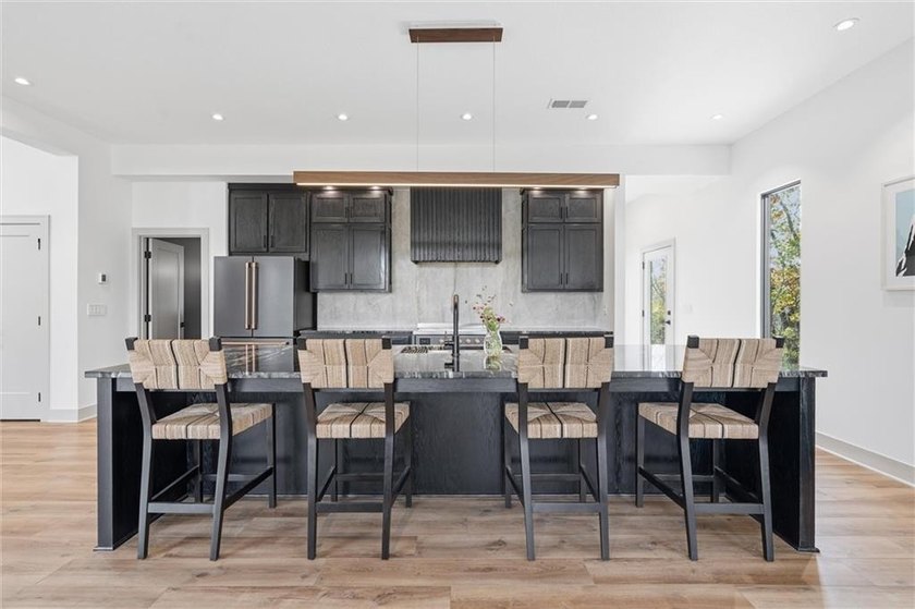Welcome to a modern masterpiece set on 30-acres that captures - photo 18