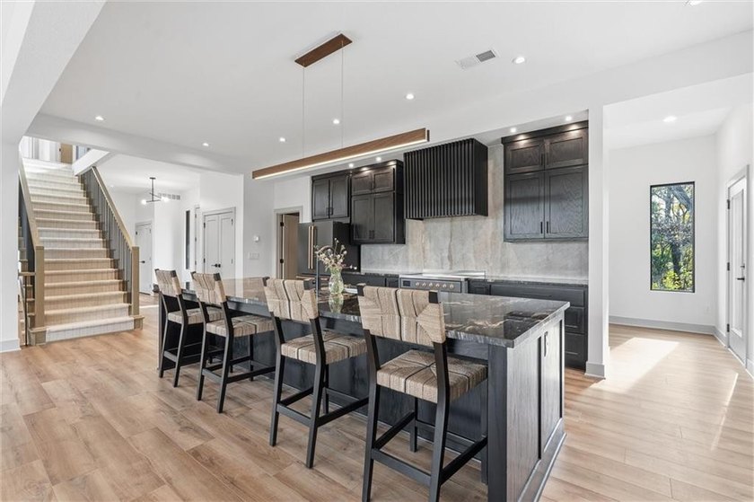 Welcome to a modern masterpiece set on 30-acres that captures - photo 19
