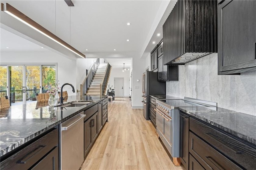 Welcome to a modern masterpiece set on 30-acres that captures - photo 20