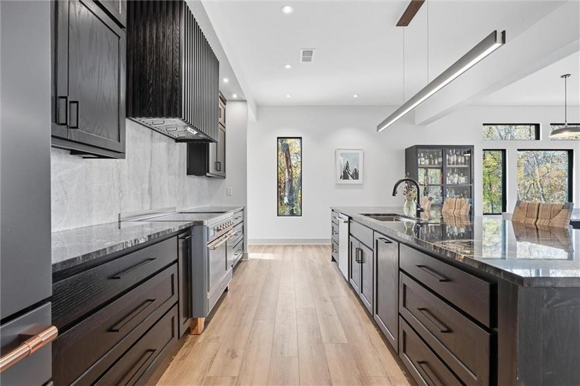 Welcome to a modern masterpiece set on 30-acres that captures - photo 21