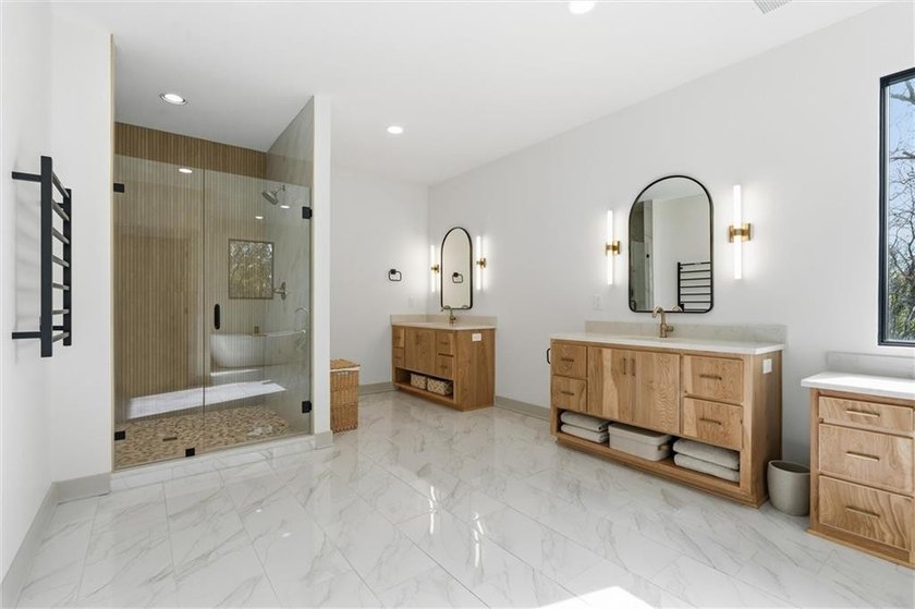 Welcome to a modern masterpiece set on 30-acres that captures - photo 34