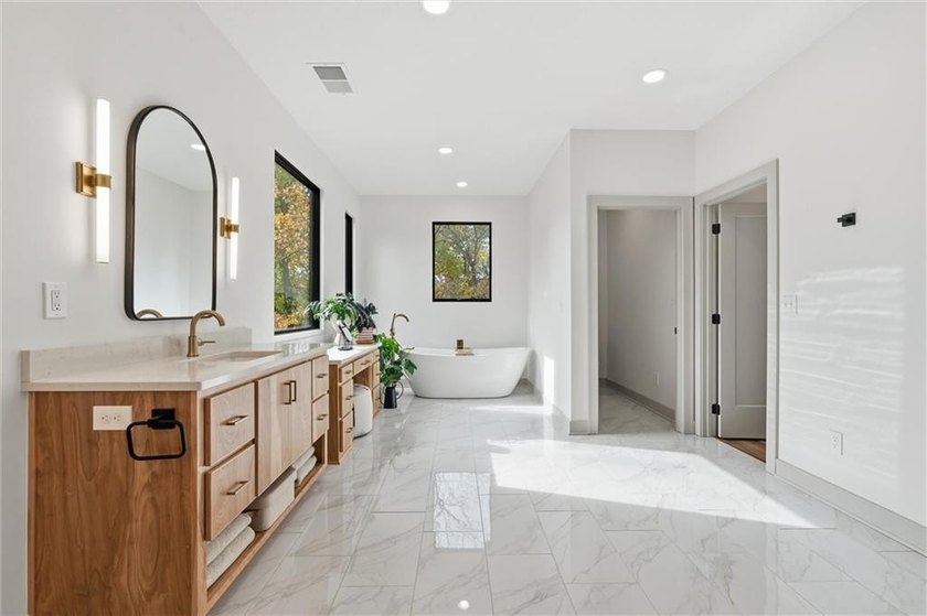 Welcome to a modern masterpiece set on 30-acres that captures - photo 38