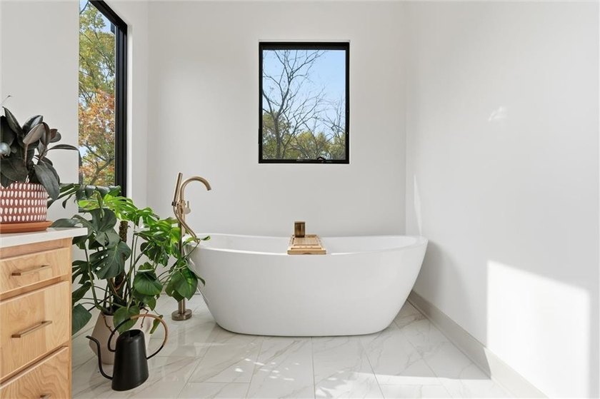 Welcome to a modern masterpiece set on 30-acres that captures - photo 39