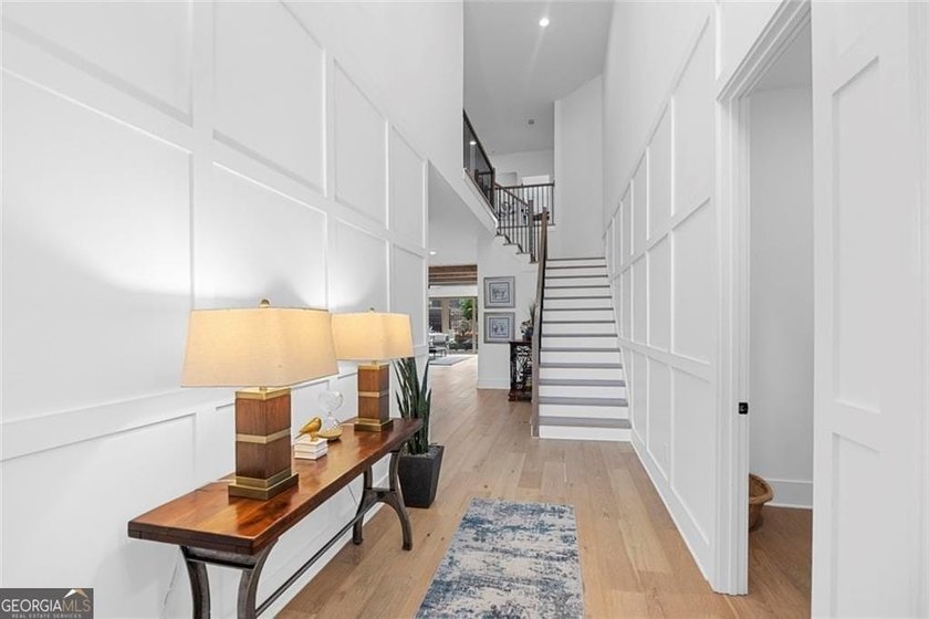 Tucked in the heart of Bridgemill, this luxury townhome lives - photo 16