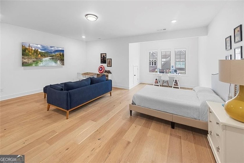 Tucked in the heart of Bridgemill, this luxury townhome lives - photo 21