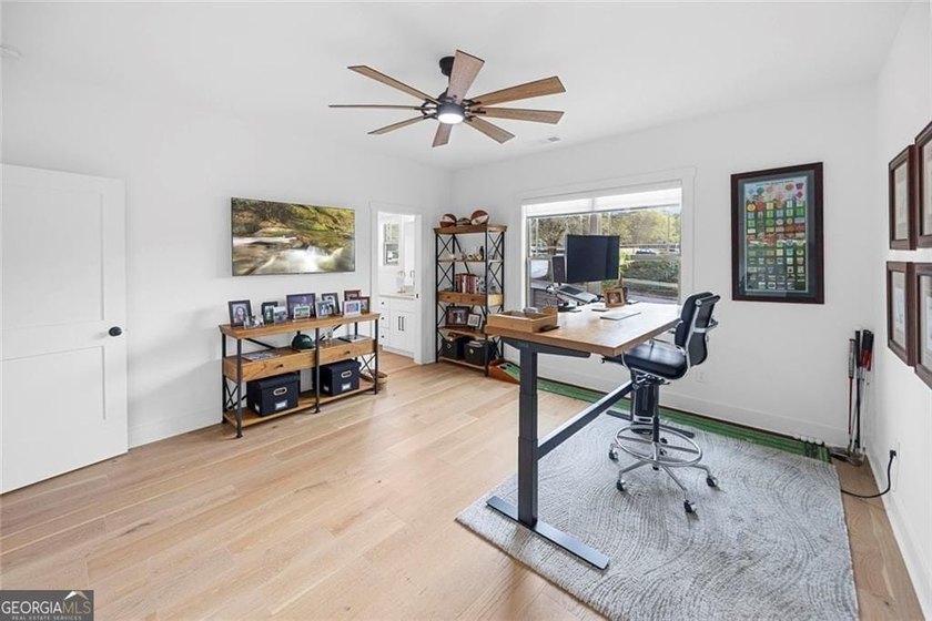Tucked in the heart of Bridgemill, this luxury townhome lives - photo 28