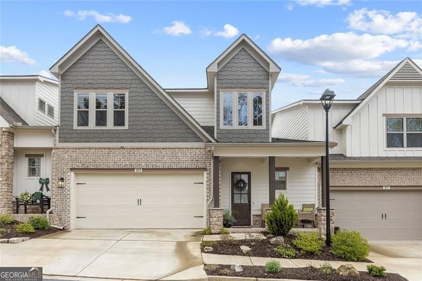 Tucked in the heart of Bridgemill, this luxury townhome lives - photo 32