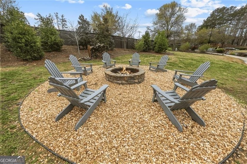 Tucked in the heart of Bridgemill, this luxury townhome lives - photo 33