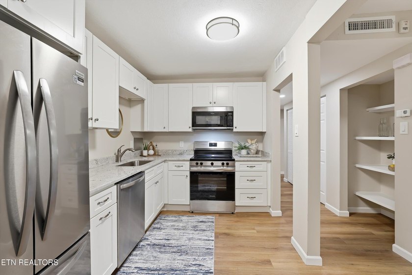 Experience effortless living in the heart of Sequoyah Hills at - photo 10