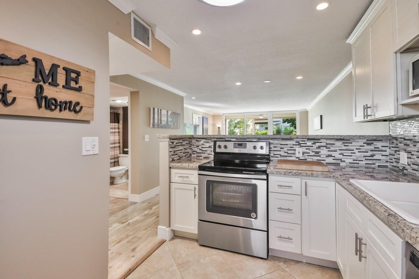 Beautifully renovated 2-bedroom, 2-bathroom first-floor condo in - photo 4