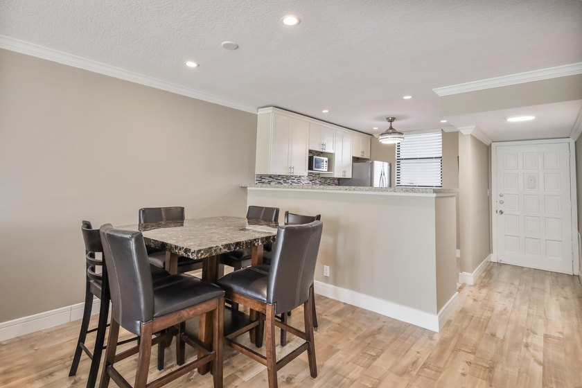 Beautifully renovated 2-bedroom, 2-bathroom first-floor condo in - photo 5