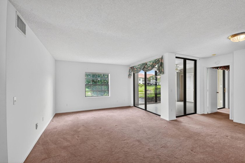 Create your own masterpiece in this spacious first floor lake - photo 4