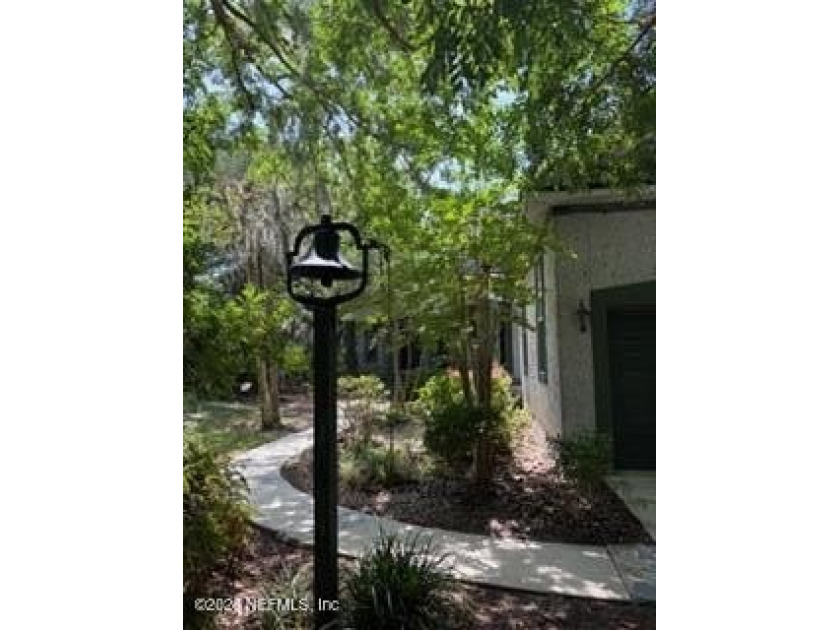 Nestled beneath a canopy of majestic live oaks and surrounded by - photo 7