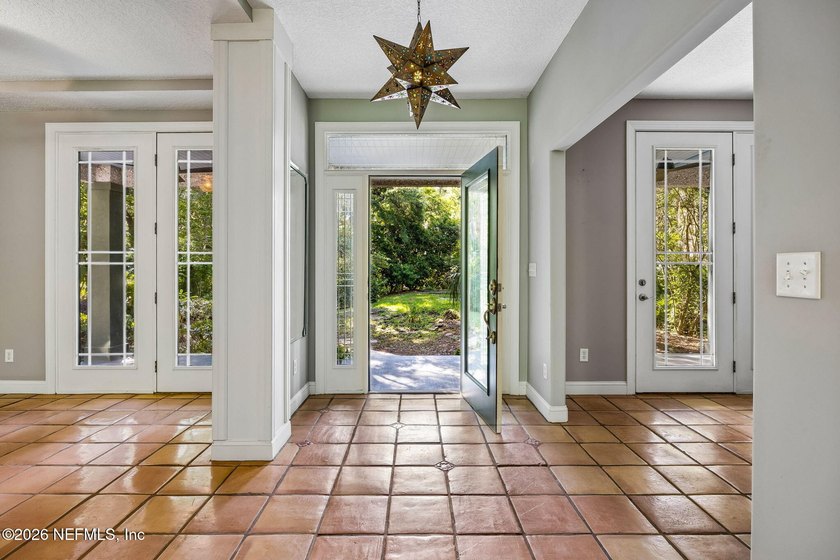 Nestled beneath a canopy of majestic live oaks and surrounded by - photo 8