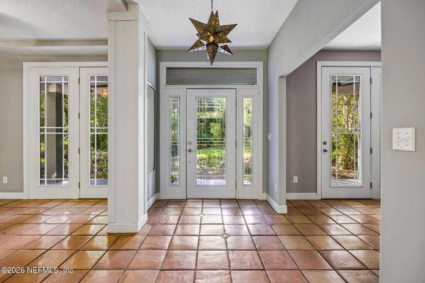 Nestled beneath a canopy of majestic live oaks and surrounded by - photo 9