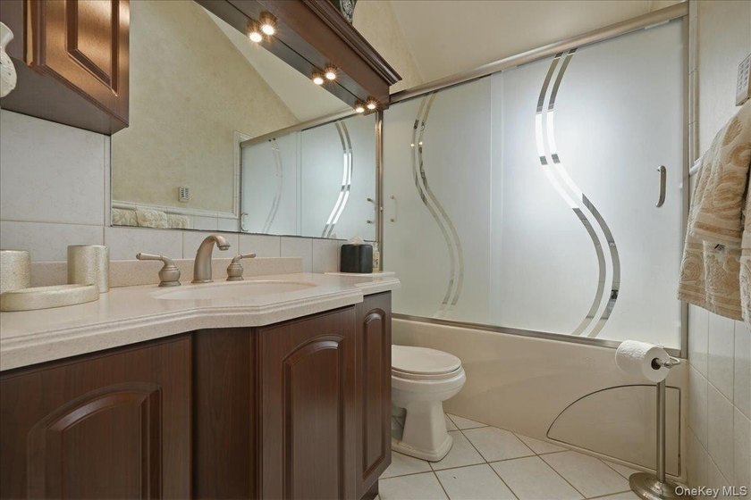 A charming expanded 3-bedroom, 2.5-bath split-level home located - photo 24