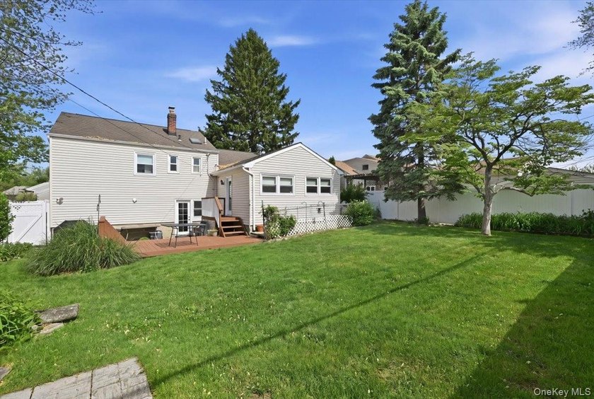 A charming expanded 3-bedroom, 2.5-bath split-level home located - photo 37