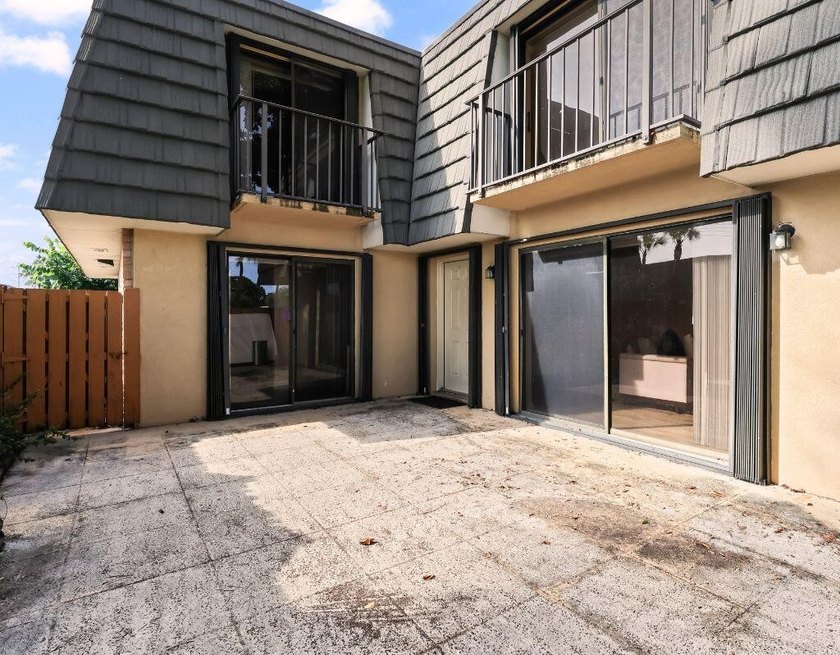 Welcome to this updated 2BR/2.5BA townhouse in the Village of - photo 2