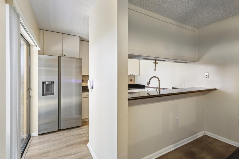 Welcome to this updated 2BR/2.5BA townhouse in the Village of - photo 5