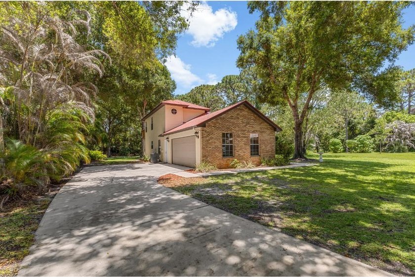 Welcome home to Holiday Pines, one of North Fort Pierce's most - photo 2
