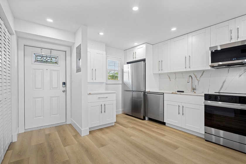Welcome to Unit 109 at Boca House - a stunning, fully renovated - photo 2