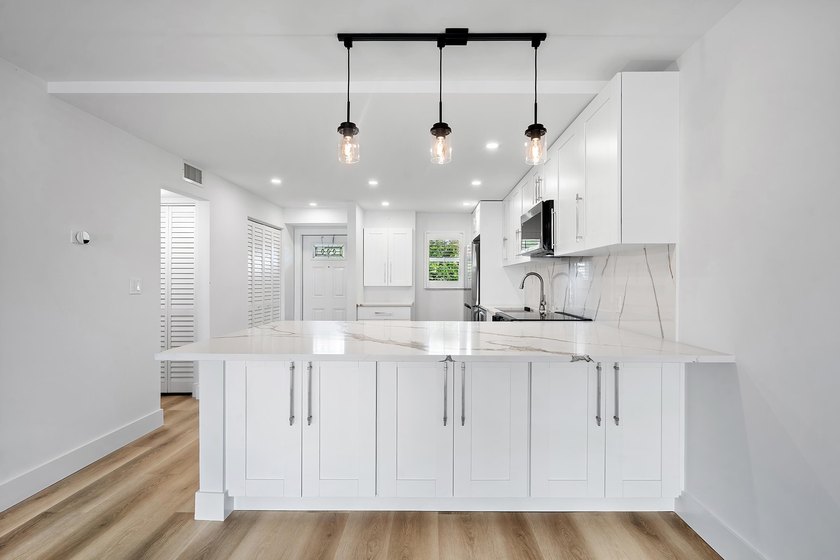 Welcome to Unit 109 at Boca House - a stunning, fully renovated - photo 5