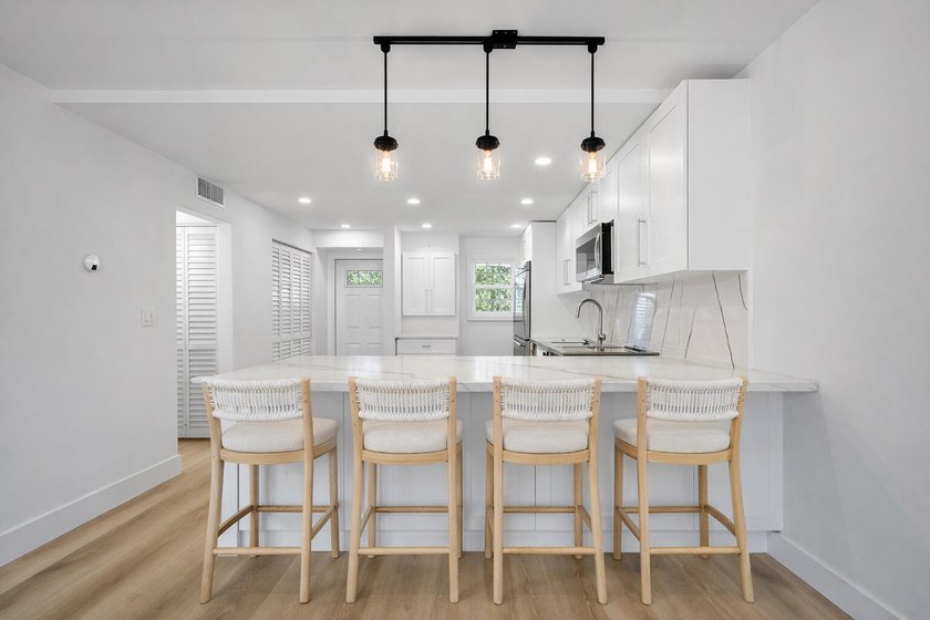 Welcome to Unit 109 at Boca House - a stunning, fully renovated - photo 6