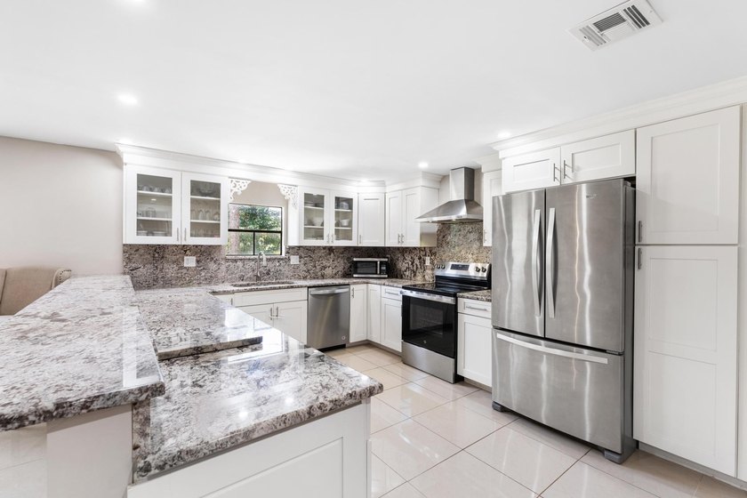 This beautifully remodeled 3-bedroom, 2-bathroom home offers - photo 12