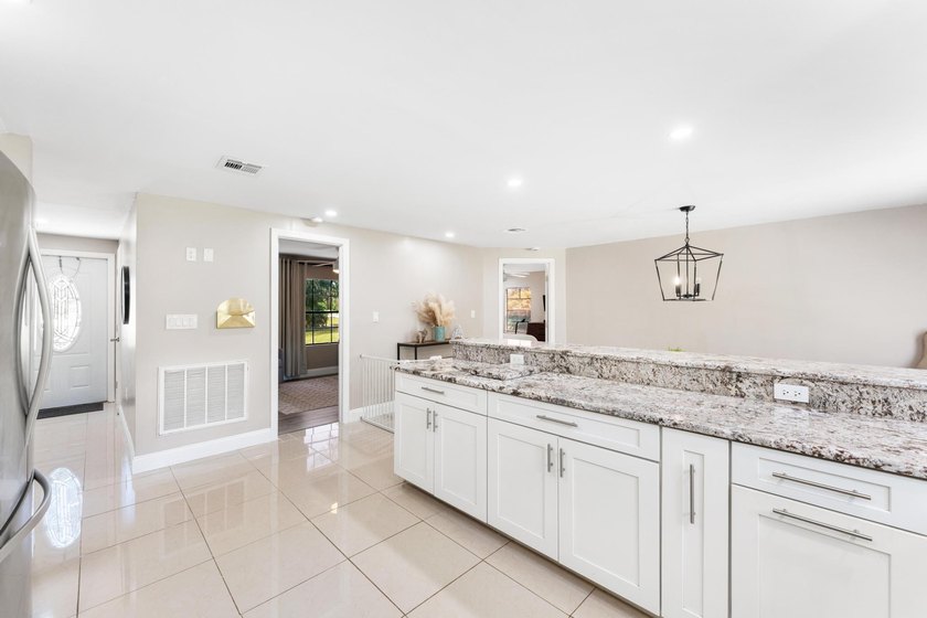This beautifully remodeled 3-bedroom, 2-bathroom home offers - photo 13
