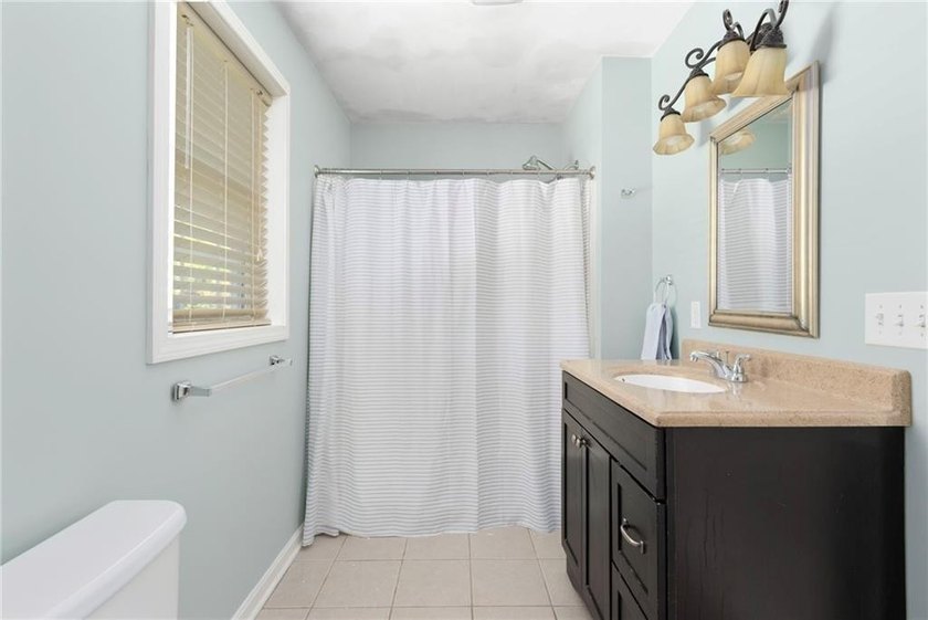 Nestled on a quiet dead-end street in Kingston, this spacious - photo 24