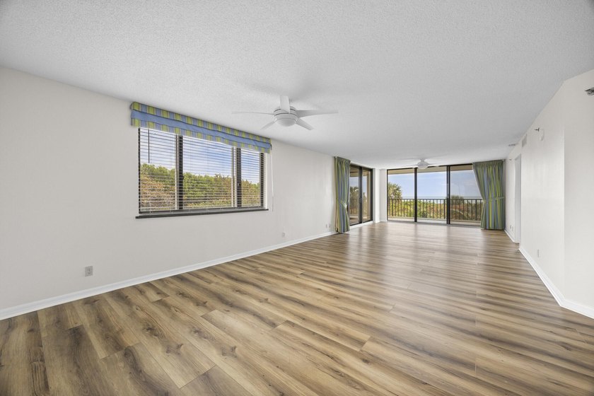 RARE 3 BEDROOM/2BATH CORNER UNIT WITH TWO GARAGES! Step inside - photo 3