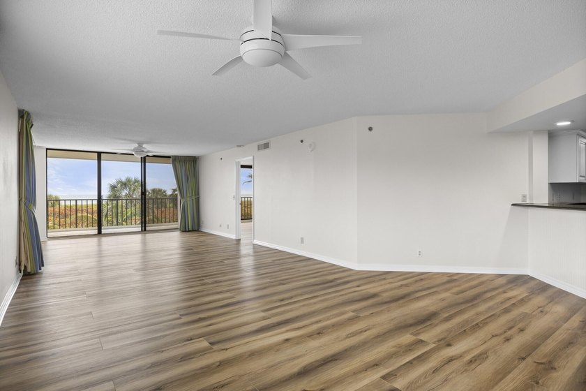 RARE 3 BEDROOM/2BATH CORNER UNIT WITH TWO GARAGES! Step inside - photo 6