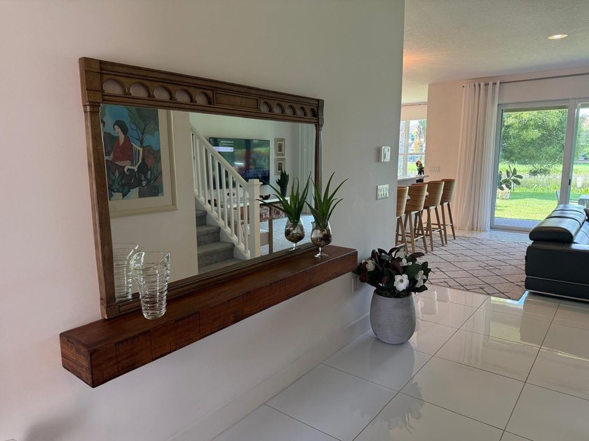Welcome to this exceptional two-story residence, nestled within - photo 4