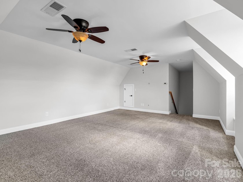 Welcome home to this beautifully maintained stucco and stone - photo 34