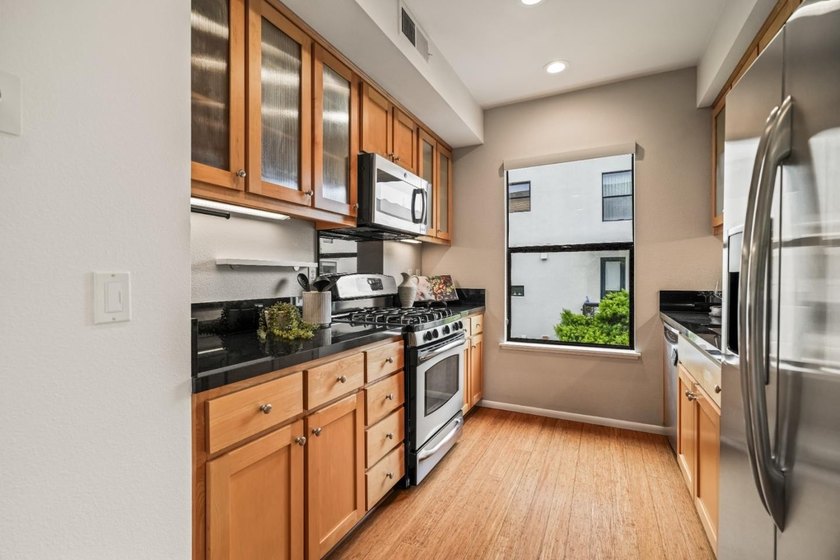 Welcome to 1202 66th St, a bright and modern end-unit tri-level - photo 11