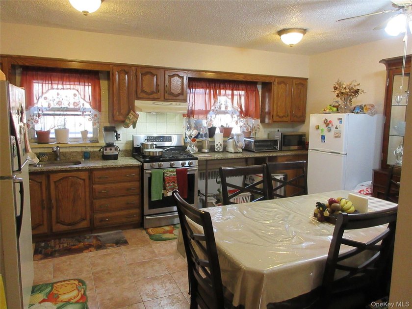 Well-maintained attached brick single- family home located in - photo 3